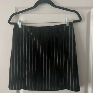 Black mini skirt with white stripes.